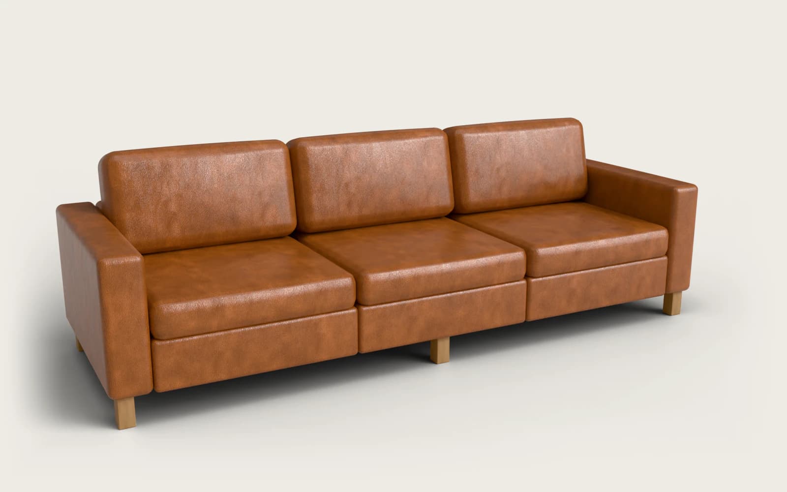 Still render of the modular sofa demo: a three-seat sofa in cognac leather with oak block legs